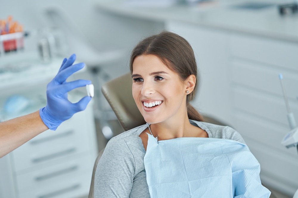 Patient receiving professional teeth whitening at a dental office in Houma, LA